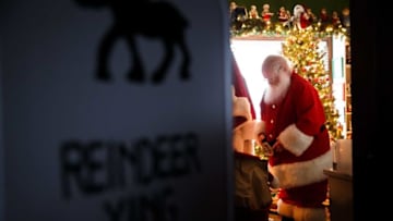 In his office known as the "Santa room," Dave Greulich, 68 of Ames, gets ready to go outside and hear kids' Christmas wishes as Santa Claus on Dec. 15, 2020, in Ames. For the past seven years Greulich has turned his front yard into a Christmas wonderland for families to visit Santa.20201215 009 Santa Bp Jpg