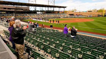 Feb 28, 2021; Scottsdale, Arizona, USA; Social distanced fans stand for the national anthem during the spring training opener as the Colorado Rockies host the Arizona Diamondbacks at Salt River Fields at Talking Stick. Mandatory Credit: Rob Schumacher/Arizona Republic-USA TODAY NETWORK