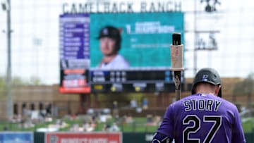 Mar 7, 2021; Phoenix, Arizona, USA; Colorado Rockies shortstop Trevor Story (27) waits on deck against the Chicago White Sox during the fourth inning of a spring training game at Camelback Ranch. Mandatory Credit: Joe Camporeale-USA TODAY Sports