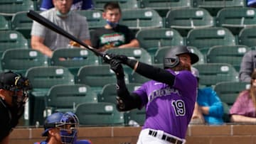 Mar 15, 2021; Salt River Pima-Maricopa, Arizona, USA; Colorado Rockies right fielder Charlie Blackmon (19) hits against the Los Angeles Dodgers during a spring training game at Salt River Fields at Talking Stick. Mandatory Credit: Rick Scuteri-USA TODAY Sports