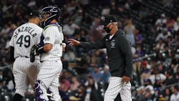 Apr 2, 2021; Denver, Colorado, USA; Colorado Rockies manager Bud Black (10) pulls starting pitcher Antonio Senzatela (49) as catcher Dom Nunez (3) observes in the fourth inning against the Colorado Rockies at Coors Field. Mandatory Credit: Ron Chenoy-USA TODAY Sports