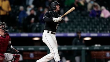 Apr 6, 2021; Denver, Colorado, USA; Colorado Rockies third baseman Ryan McMahon (24) watches his ball on a solo home run in the second inning against the Arizona Diamondbacks at Coors Field. Mandatory Credit: Isaiah J. Downing-USA TODAY Sports