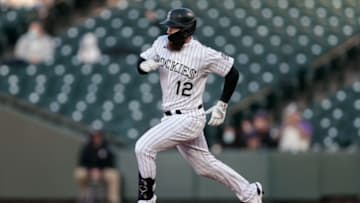 Apr 7, 2021; Denver, Colorado, USA; Colorado Rockies right fielder Chris Owings (12) rounds the bases on an RBI triple in the first inning against the Arizona Diamondbacks at Coors Field. Mandatory Credit: Isaiah J. Downing-USA TODAY Sports