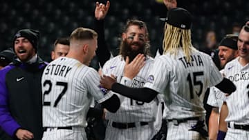 May 4, 2021; Denver, Colorado, USA; Colorado Rockies right fielder Charlie Blackmon (19) celebrates his three-run home run with shortstop Trevor Story (27) and left fielder Raimel Tapia (15) to defeat San Francisco Giants the ninth inning at Coors Field. Mandatory Credit: Ron Chenoy-USA TODAY Sports