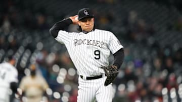 May 11, 2021; Denver, Colorado, USA; Colorado Rockies first baseman Connor Joe (9) fields the ball in the in the sixth inning against the San Diego Padresat Coors Field. Mandatory Credit: Ron Chenoy-USA TODAY Sports