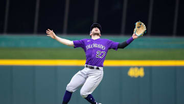 Jun 12, 2021; Cincinnati, Ohio, USA; Colorado Rockies shortstop Trevor Story (27) calls for the ball before a catch in the outfield during the sixth inning against the Cincinnati Reds at Great American Ball Park. Mandatory Credit: Jordan Prather-USA TODAY Sports