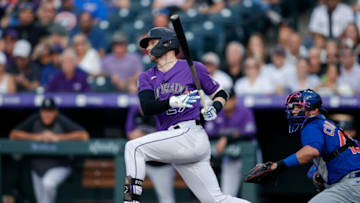 Aug 4, 2021; Denver, Colorado, USA; Colorado Rockies shortstop Trevor Story (27) watches hits a sacrifice to drive in a run against the Chicago Cubs in the first inning at Coors Field. Mandatory Credit: Isaiah J. Downing-USA TODAY Sports
