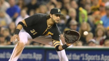 Aug 21, 2015; Pittsburgh, PA, USA; Pittsburgh Pirates first baseman Michael Morse (31) takes a throw at first base against the San Francisco Giants during the ninth inning at PNC Park. The Giants won 6-4. Mandatory Credit: Charles LeClaire-USA TODAY Sports