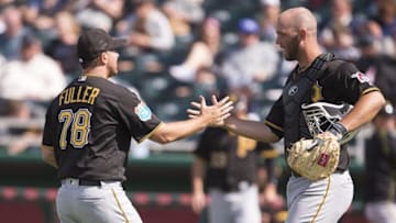 Mar 21, 2016; Fort Myers, FL, USA; Pittsburgh Pirates relief pitcher Jim Fuller (78) and catcher Jacob Stallings (83) celebrate the win over the Minnesota Twins at CenturyLink Sports Complex. The Pirates shut out the Twins 2-0. Mandatory Credit: Jerome Miron-USA TODAY Sports