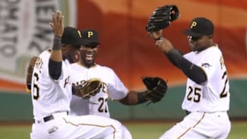 Apr 6, 2016; Pittsburgh, PA, USA; Pittsburgh Pirates left fielder Starling Marte (6) and center fielder Andrew McCutchen (22) and right fielder Gregory Polanco (25) celebrate in the outfield after defeating the St. Louis Cardinals at PNC Park. The Pirates won 5-1. Mandatory Credit: Charles LeClaire-USA TODAY Sports