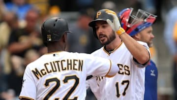 May 4, 2016; Pittsburgh, PA, USA; Pittsburgh Pirates pinch hitter Matt Joyce (17) celebrates with center fielder Andrew McCutchen (22) after hitting a two run pinch hit home run against the Chicago Cubs during the seventh inning at PNC Park. Mandatory Credit: Charles LeClaire-USA TODAY Sports