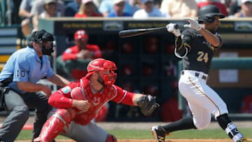 Mar 7, 2016; Bradenton, FL, USA; Pittsburgh Pirates second baseman Cole Figueroa (24) bats as Philadelphia Phillies catcher Cameron Rupp (29) catches under the view of umpire Phil Cuzzi (10) during the second inning of a spring training baseball game at McKechnie Field. Mandatory Credit: Reinhold Matay-USA TODAY Sports