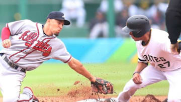 Jun 28, 2015; Pittsburgh, PA, USA; Pittsburgh Pirates third baseman Jung Ho Kang (27) steals second base ahead of the tag attempt by Atlanta Braves second baseman Jace Peterson (8) during the first inning at PNC Park. Mandatory Credit: Charles LeClaire-USA TODAY Sports