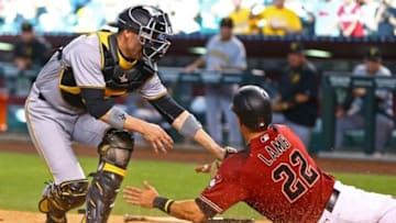 Apr 24, 2016; Phoenix, AZ, USA; Pittsburgh Pirates catcher Chris Stewart (left) tags out Arizona Diamondbacks base runner Jake Lamb in the tenth inning at Chase Field. The Pirates defeated the Diamondbacks 12-10 in 13 innings. Mandatory Credit: Mark J. Rebilas-USA TODAY Sports