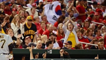 May 6, 2016; St. Louis, MO, USA; Pittsburgh Pirates third baseman Jung Ho Kang (27) celebrates with teammates after hitting a solo home run off of St. Louis Cardinals relief pitcher Kevin Siegrist (not pictured) during the eighth inning at Busch Stadium. The Pirates won 4-2. Mandatory Credit: Jeff Curry-USA TODAY Sports