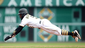 Jun 7, 2016; Pittsburgh, PA, USA; Pittsburgh Pirates second baseman Josh Harrison (5) slides into second base with a steal against the New York Mets during the fifth inning at PNC Park. The Pirates won game one of a double header 3-1. Mandatory Credit: Charles LeClaire-USA TODAY Sports