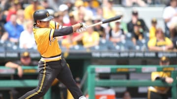 Jun 5, 2016; Pittsburgh, PA, USA; Pittsburgh Pirates third baseman Jung Ho Kang (27) singles against the Los Angeles Angels during the fifth inning at PNC Park. Mandatory Credit: Charles LeClaire-USA TODAY Sports