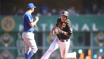 May 23, 2015; Pittsburgh, PA, USA; Pittsburgh Pirates shortstop Jung Ho Kang (right) runs the bases on his way to scoring a run against the New York Mets during the fourth inning at PNC Park. Mandatory Credit: Charles LeClaire-USA TODAY Sports