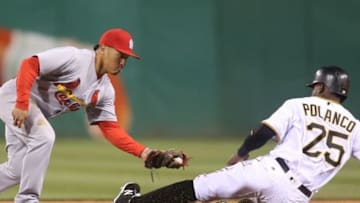 Apr 6, 2016; Pittsburgh, PA, USA; St. Louis Cardinals second baseman Kolten Wong (16) tags out Pittsburgh Pirates right fielder Gregory Polanco (25) on a caught stealing attempt during the fourth inning at PNC Park. Mandatory Credit: Charles LeClaire-USA TODAY Sports