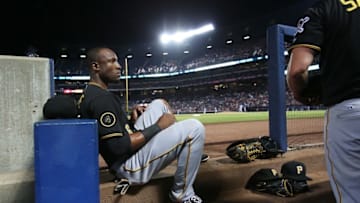 Sep 25, 2014; Atlanta, GA, USA; Pittsburgh Pirates left fielder Starling Marte (6) talks with a teammate before they play defense in the sixth inning of their game against the Atlanta Braves at Turner Field. The Pirates won 10-1. Mandatory Credit: Jason Getz-USA TODAY Sports