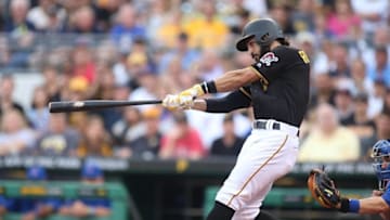 Jul 8, 2016; Pittsburgh, PA, USA; Pittsburgh Pirates shortstop Sean Rodriguez (3) hits a two run home run against the Chicago Cubs during the second inning at PNC Park. Mandatory Credit: Charles LeClaire-USA TODAY Sports