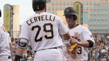 Jul 27, 2016; Pittsburgh, PA, USA; Pittsburgh Pirates third baseman David Freese (23) is greeted by catcher Francisco Cervelli (29) after scoring a run against the Seattle Mariners during the third inning in an inter-league game at PNC Park. Mandatory Credit: Charles LeClaire-USA TODAY Sports