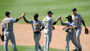 August 14, 2016; Los Angeles, CA, USA; Pittsburgh Pirates third baseman Jung Ho Kang (27), second baseman Josh Harrison (5), third baseman David Freese (23), center fielder Andrew McCutchen (22) and shortstop Jordy Mercer (10) celebrate the 11-3 victory against Los Angeles Dodgers at Dodger Stadium. Mandatory Credit: Gary A. Vasquez-USA TODAY Sports