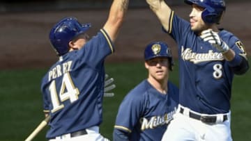 Aug 24, 2016; Milwaukee, WI, USA; Milwaukee Brewers left fielder Ryan Braun (8) celebrates with second baseman Hernan Perez (14) after hitting a two-run homer in the seventh inning during the game against the Colorado Rockies at Miller Park. Mandatory Credit: Benny Sieu-USA TODAY Sports