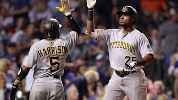 Aug 29, 2016; Chicago, IL, USA; Pittsburgh Pirates right fielder Gregory Polanco (25) celebrates with second baseman Josh Harrison (5) after hitting a three run home run during the sixth inning against the Chicago Cubs at Wrigley Field. Mandatory Credit: Caylor Arnold-USA TODAY Sports