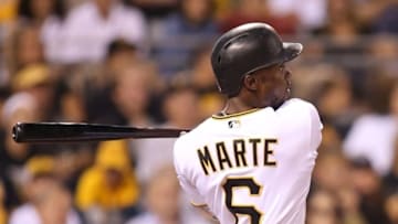 Sep 2, 2016; Pittsburgh, PA, USA; Pittsburgh Pirates left fielder Starling Marte (6) doubles against the Milwaukee Brewers during the fourth inning at PNC Park. Mandatory Credit: Charles LeClaire-USA TODAY Sports