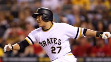 Sep 7, 2016; Pittsburgh, PA, USA; Pittsburgh Pirates third baseman Jung Ho Kang (27) singles against the St. Louis Cardinals during the third inning at PNC Park. Mandatory Credit: Charles LeClaire-USA TODAY Sports