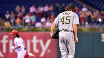 Sep 12, 2016; Philadelphia, PA, USA; Pittsburgh Pirates starting pitcher Gerrit Cole (45) reacts as Philadelphia Phillies shortstop Freddy Galvis (13) runs the bases after hitting a solo home run during the second inning at Citizens Bank Park. Mandatory Credit: Eric Hartline-USA TODAY Sports