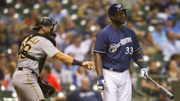 Sep 21, 2016; Milwaukee, WI, USA; Pittsburgh Pirates catcher Francisco Cervelli (29) tags out Milwaukee Brewers first baseman Chris Carter (33) to complete the strikeout during the third inning at Miller Park. Mandatory Credit: Jeff Hanisch-USA TODAY Sports