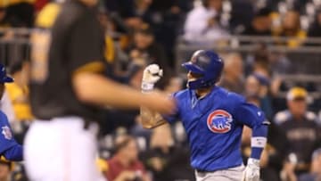 Sep 26, 2016; Pittsburgh, PA, USA; Chicago Cubs third baseman Javier Baez (9) circles the bases on a grand slam home run against Pittsburgh Pirates starting pitcher Chad Kuhl (L) during the fourth inning at PNC Park. Mandatory Credit: Charles LeClaire-USA TODAY Sports
