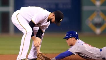 Sep 27, 2016; Pittsburgh, PA, USA; Chicago Cubs right fielder Chris Coghlan (8) steals second base ahead of Pittsburgh Pirates shortstop Jordy Mercer (10) during the first inning against at PNC Park. Mandatory Credit: Charles LeClaire-USA TODAY Sports