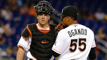 Sep 5, 2016; Miami, FL, USA; Miami Marlins catcher J.T. Realmuto (left) talks with relief pitcher Nefi Ogando (right) on the pitchers mound during the eighth inning against the Philadelphia Phillies at Marlins Park. The Phillies won 6-2. Mandatory Credit: Steve Mitchell-USA TODAY Sports