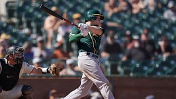 SAN FRANCISCO, CA - AUGUST 14: Corban Joseph #56 of the Oakland Athletics hits a sacrifice fly scoring Mark Canha #20 against the San Francisco Giants in the top of the ninth inning at Oracle Park on August 14, 2019 in San Francisco, California. (Photo by Thearon W. Henderson/Getty Images)