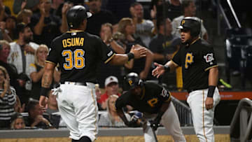 PITTSBURGH, PA - SEPTEMBER 06: Melky Cabrera #53 of the Pittsburgh Pirates celebrates with Jose Osuna #36 after they both came around to score on a two run RBI triple by Adam Frazier #26 in the seventh inning during the game against the St. Louis Cardinals at PNC Park on September 6, 2019 in Pittsburgh, Pennsylvania. (Photo by Justin Berl/Getty Images)