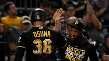 PITTSBURGH, PA - SEPTEMBER 25: Jose Osuna #36 of the Pittsburgh Pirates celebrates with Starling Marte #6 after coming around to score on an RBI double by Erik Gonzalez #2 in the fourth inning during the game against the Chicago Cubs at PNC Park on September 25, 2019 in Pittsburgh, Pennsylvania. (Photo by Justin Berl/Getty Images)