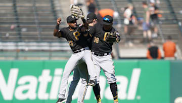 SAN FRANCISCO, CALIFORNIA - SEPTEMBER 12: Pablo Reyes #15, Bryan Reynolds #10 and Jose Osuna #36 of the Pittsburgh Pirates celebrates defeating the San Francisco Giants 4-2 at Oracle Park on September 12, 2019 in San Francisco, California. (Photo by Thearon W. Henderson/Getty Images)