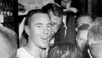 PITTSBURGH - 1960: Bill Mazeroski #9 of the Pittsburgh Pirates talks to the media in the locker room after a 1960 World Series game against the New York Yankees at Forbes Field in Pittsburgh, Pennsylvania. (Photo by Morris Berman/MLB Photos via Getty Images)