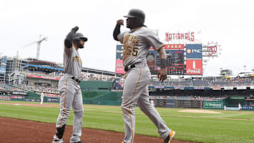 WASHINGTON, DC - APRIL 14: Josh Bell #55 of the Pittsburgh Pirates celebrates with Jason Martin #51 after scoring in the first inning against the Washington Nationals at Nationals Park on April 14, 2019 in Washington, DC. (Photo by Greg Fiume/Getty Images)