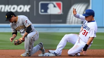 LOS ANGELES, CA - APRIL 27: Adam Frazier #26 of the Pittsburgh Pirates hangs on to the ball as Joc Pederson #31 of the Los Angeles Dodgers is out at second in the first inning of the game at Dodger Stadium on April 27, 2019 in Los Angeles, California. (Photo by Jayne Kamin-Oncea/Getty Images)