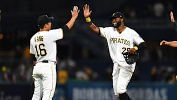 PITTSBURGH, PA - MAY 07: Gregory Polanco #25 celebrates with Jung Ho Kang #16 of the Pittsburgh Pirates after a 5-4 win over the Texas Rangers at PNC Park on May 7, 2019 in Pittsburgh, Pennsylvania. (Photo by Joe Sargent/Getty Images)