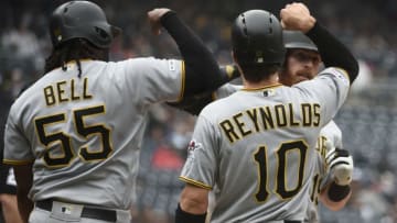 SAN DIEGO, CA - MAY 19: Colin Moran #19 of the Pittsburgh Pirates is congratulated by Josh Bell #55 and Bryan Reynolds #10 after hitting a three-run home run during the first inning of a baseball game against the San Diego Padres at Petco Park May 19, 2019 in San Diego, California. (Photo by Denis Poroy/Getty Images)