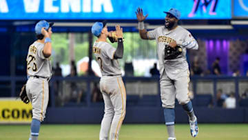 MIAMI, FL - JUNE 16: Gregory Polanco #25 of the Pittsburgh Pirates high fives Kevin Newman #27 after defeating the Miami Marlins at Marlins Park on June 16, 2019 in Miami, Florida. (Photo by Eric Espada/Getty Images)