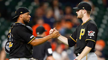 HOUSTON, TEXAS - JUNE 26: Elias Diaz #32 of the Pittsburgh Pirates shakes hands with Chris Stratton #46 after defeating the Houston Astros 14-2 at Minute Maid Park on June 26, 2019 in Houston, Texas. (Photo by Bob Levey/Getty Images)