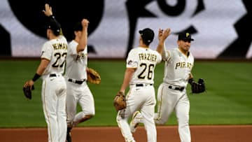 PITTSBURGH, PA - APRIL 27: Phillip Evans #24 of the Pittsburgh Pirates high fives with Adam Frazier #26 after the final out in a 2-1 win over the Kansas City Royals at PNC Park on April 27, 2021 in Pittsburgh, Pennsylvania. (Photo by Justin Berl/Getty Images)