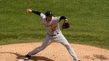 CHICAGO, ILLINOIS - AUGUST 02: Geoff Hartlieb #32 of the Pittsburgh Pirates throws a pitch against the Chicago Cubs during the fifth inning of a game at Wrigley Field on August 02, 2020 in Chicago, Illinois. (Photo by Nuccio DiNuzzo/Getty Images)