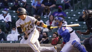 CHICAGO, ILLINOIS - APRIL 04: Phillip Evans #24 of the Pittsburgh Pirates hits an RBI single against the Chicago Cubs during the eighth inning of a game at Wrigley Field on April 04, 2021 in Chicago, Illinois. (Photo by Nuccio DiNuzzo/Getty Images)